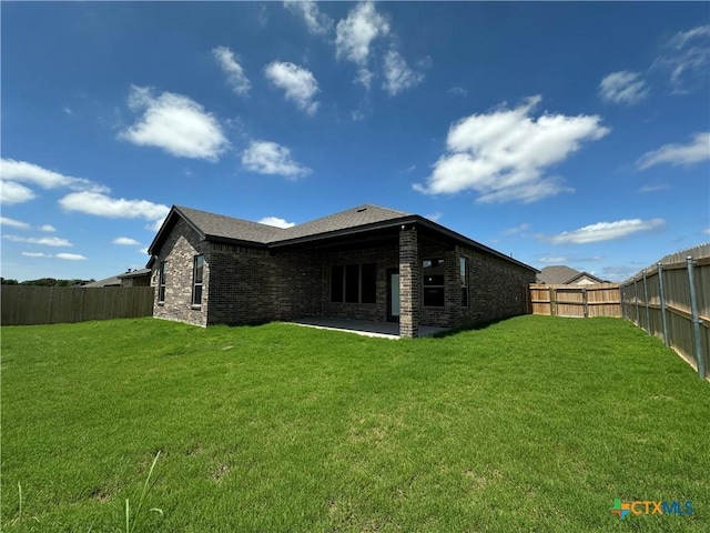 505 Magnolia Dr, Troy, TX 76571 - back of property featuring a patio area and brick siding
