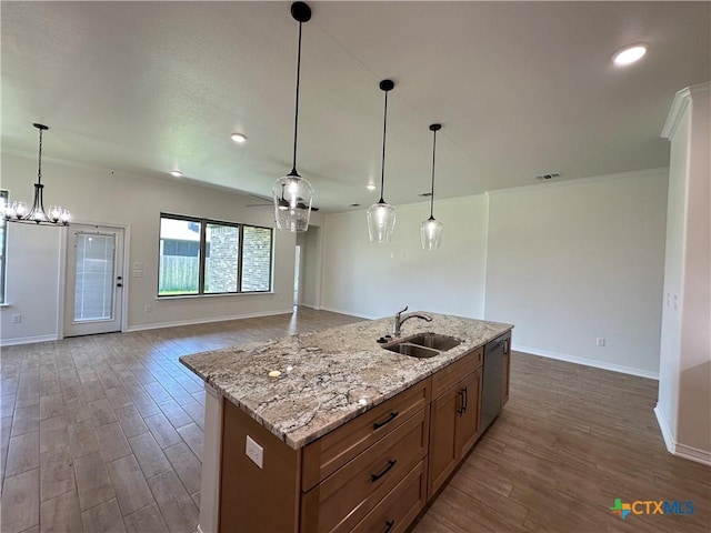 505 Magnolia Dr, Troy, TX 76571 - kitchen featuring a sink, stainless steel dishwasher, dark wood finished floors, brown cabinetry, and baseboards