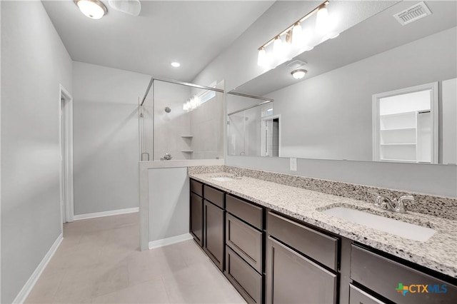 bathroom featuring walk in shower and vanity