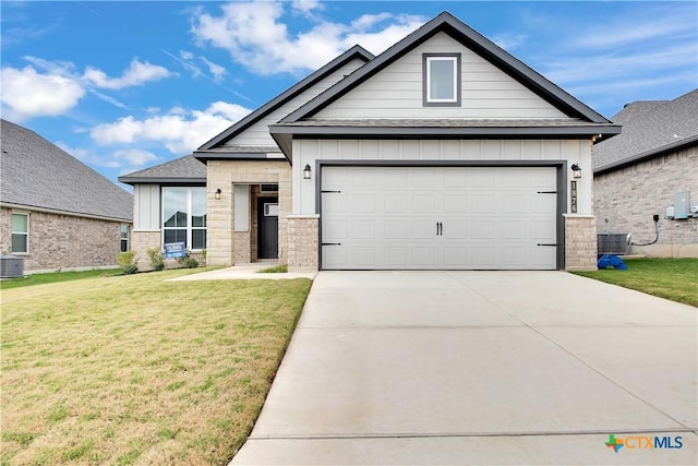 craftsman-style home featuring central AC, a garage, and a front yard