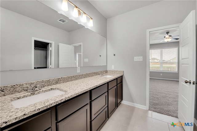 bathroom with ceiling fan, vanity, and tile patterned floors