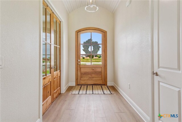 1702 Kellan Dr, Salado, TX 76571 - entryway with light wood-type flooring, baseboards, lofted ceiling, and french doors