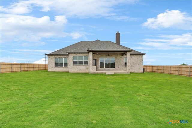 1702 Kellan Dr, Salado, TX 76571 - rear view of house with ceiling fan, a chimney, a patio area, and brick siding