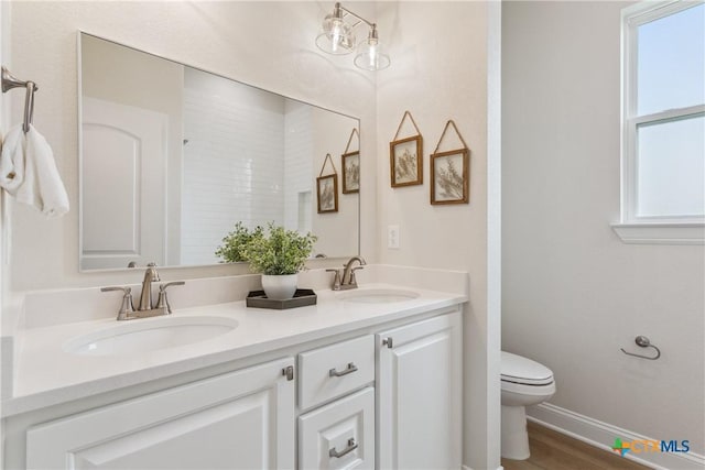 1702 Kellan Dr, Salado, TX 76571 - full bath with toilet, double vanity, and baseboards