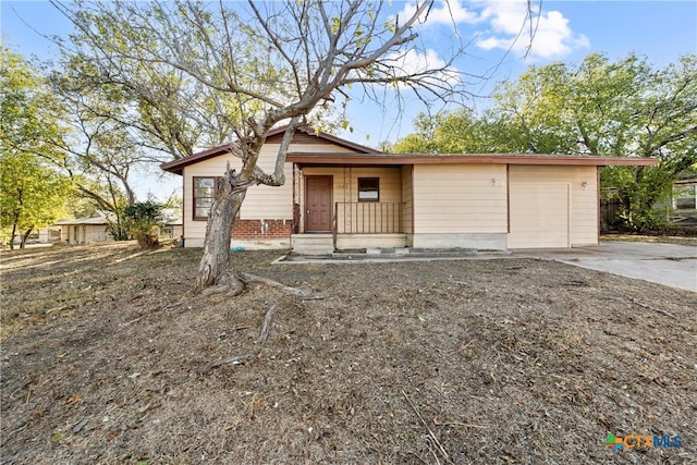 view of front of home with a garage and covered porch