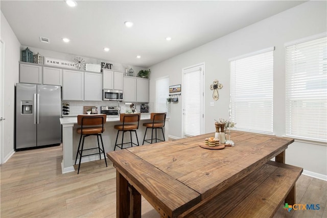 dining room with light hardwood / wood-style floors