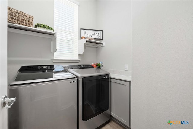 washroom with separate washer and dryer