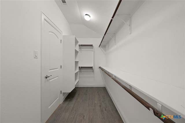 21203 Santa Rosa Ave, Lago Vista, TX 78645 - spacious closet with dark wood-style flooring and vaulted ceiling
