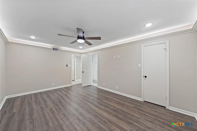 empty room with ceiling fan and dark hardwood / wood-style flooring