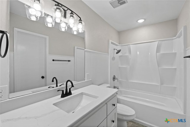 full bathroom featuring vanity, shower / bathtub combination, and toilet