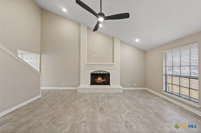 unfurnished living room featuring ceiling fan, high vaulted ceiling, and a fireplace