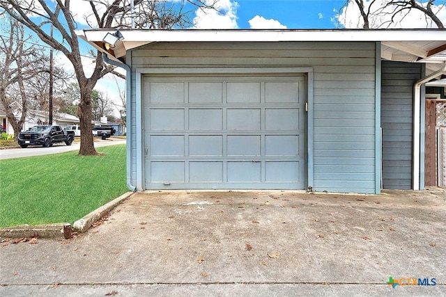 garage featuring a yard