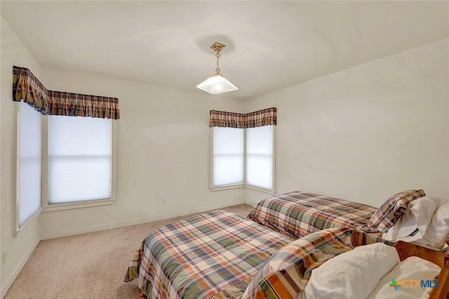 bedroom with light colored carpet