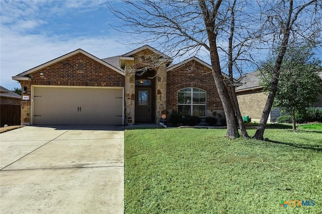 view of front of home featuring an attached garage, brick siding, concrete driveway, stone siding, and a front yard