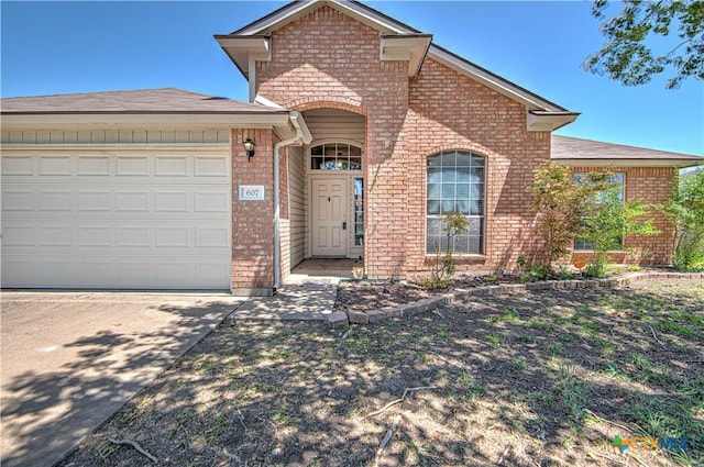 607 Moccasin Dr, Harker Heights, TX 76548 - traditional-style house featuring brick siding, driveway, and a garage