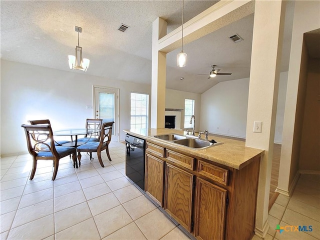 607 Moccasin Dr, Harker Heights, TX 76548 - kitchen featuring black dishwasher, brown cabinetry, a fireplace, ceiling fan, and pendant lighting