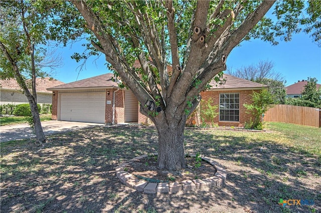607 Moccasin Dr, Harker Heights, TX 76548 - view of front of property featuring brick siding, driveway, a shingled roof, and a garage