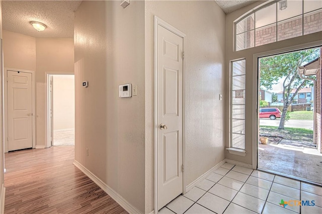 607 Moccasin Dr, Harker Heights, TX 76548 - foyer featuring a textured ceiling and light wood-style floors