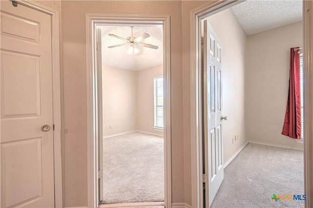 607 Moccasin Dr, Harker Heights, TX 76548 - corridor with carpet flooring and a textured ceiling