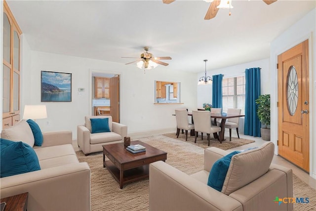 601 Royal Sage Dr, Seguin, TX 78155 - entrance foyer with ceiling fan with notable chandelier, baseboards, and light colored carpet