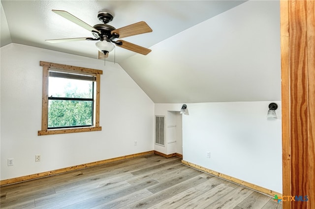 additional living space featuring lofted ceiling, light hardwood / wood-style flooring, and ceiling fan