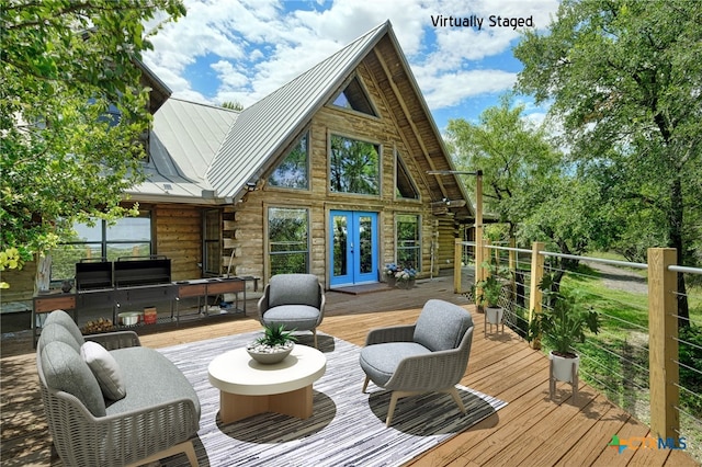 deck with outdoor lounge area, grilling area, and french doors