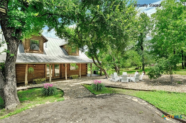 exterior space with an outdoor fire pit