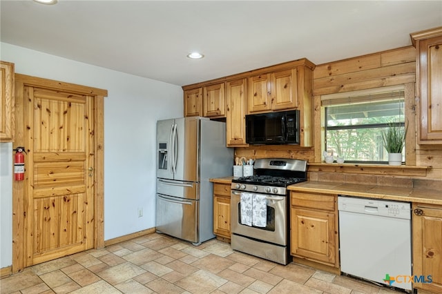 kitchen with stainless steel appliances and tile counters