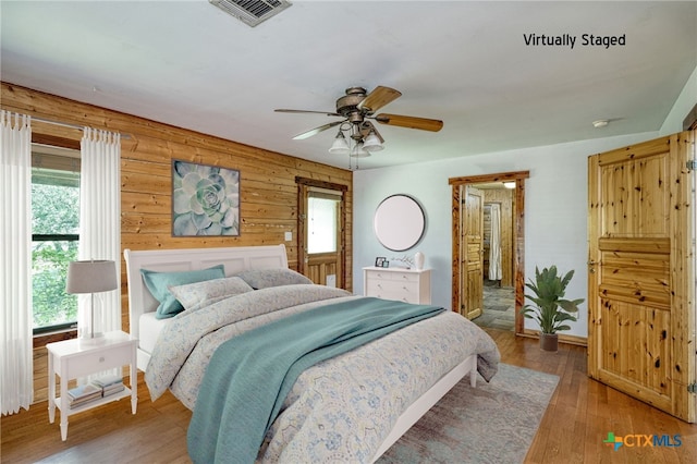 bedroom featuring light hardwood / wood-style flooring and ceiling fan