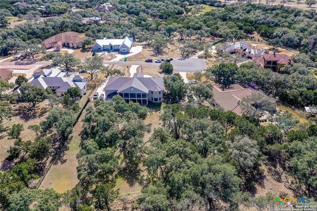 aerial view featuring a residential view and a view of trees