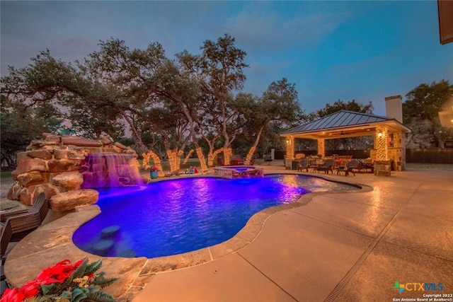 outdoor pool with an in ground hot tub, a gazebo, and a patio