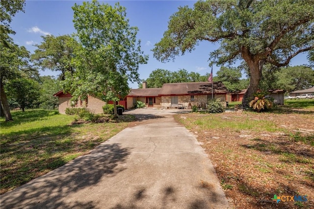 408 Royal Oak Dr, Victoria, TX 77905 - view of front of home with a chimney and concrete driveway