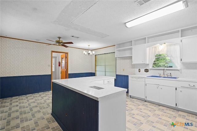 408 Royal Oak Dr, Victoria, TX 77905 - kitchen featuring dishwasher, a sink, wallpapered walls, a wainscoted wall, and open shelves