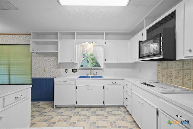 408 Royal Oak Dr, Victoria, TX 77905 - kitchen featuring white appliances, a sink, white cabinets, light countertops, and a textured ceiling