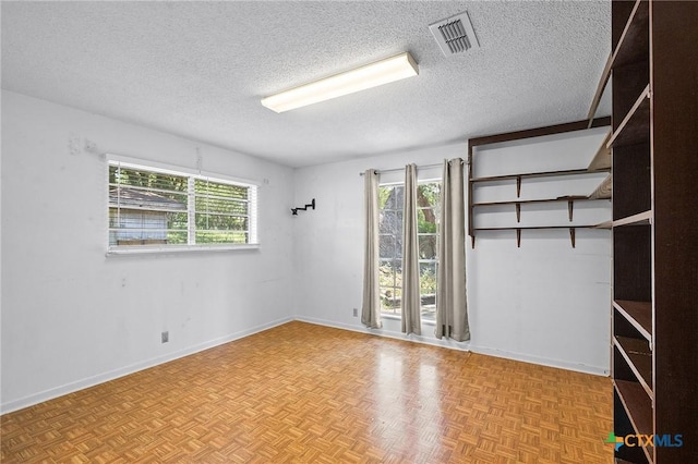 408 Royal Oak Dr, Victoria, TX 77905 - unfurnished room featuring a textured ceiling and baseboards