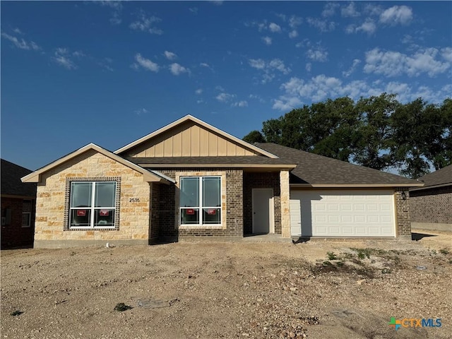 2516 Cowgirl Trl, Belton, TX 76513 - ranch-style home featuring a garage, brick siding, board and batten siding, and dirt driveway