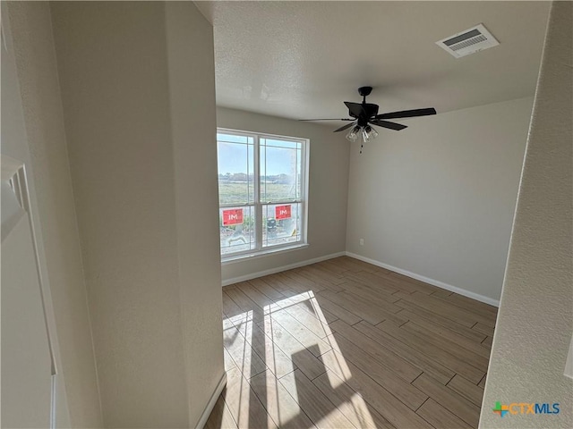2516 Cowgirl Trl, Belton, TX 76513 - spare room with wood finish floors and ceiling fan