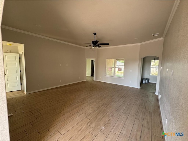 2516 Cowgirl Trl, Belton, TX 76513 - empty room with arched walkways, a ceiling fan, wood finished floors, and ornamental molding