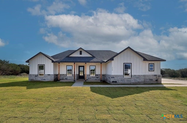 modern inspired farmhouse with a front lawn and a porch