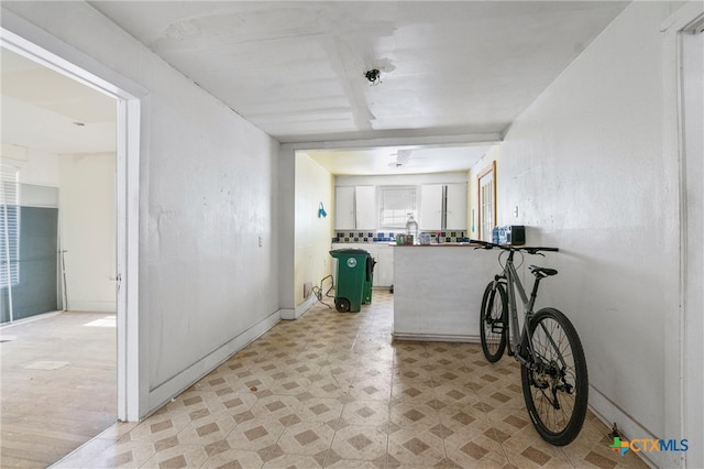 hallway with light wood-type flooring