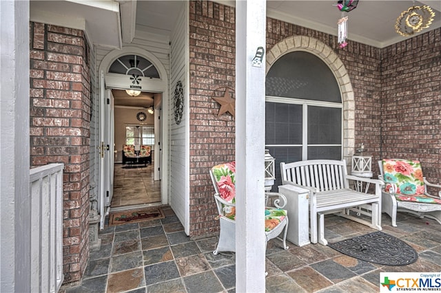 view of exterior entry with covered porch