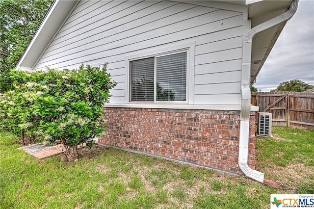 view of property exterior with a yard