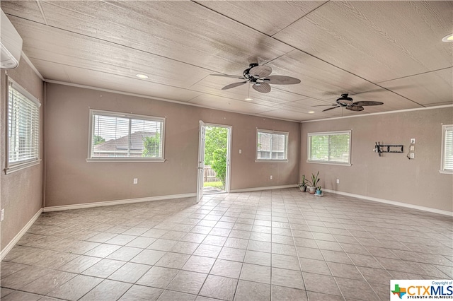 empty room with an AC wall unit, plenty of natural light, ceiling fan, and light tile patterned flooring