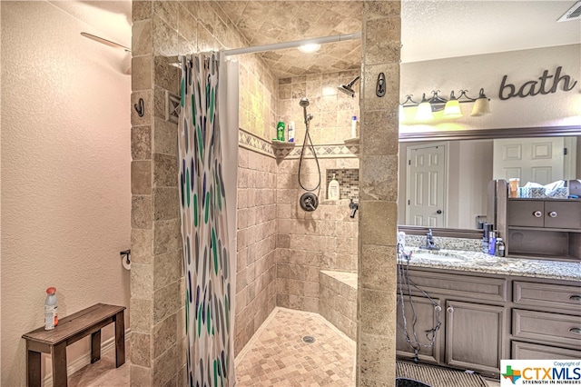 bathroom with vanity and a shower with shower curtain