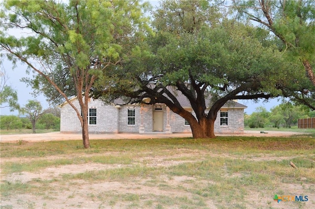 425 County Road 3152, Kempner, TX 76539 - view of property hidden behind natural elements with stone siding