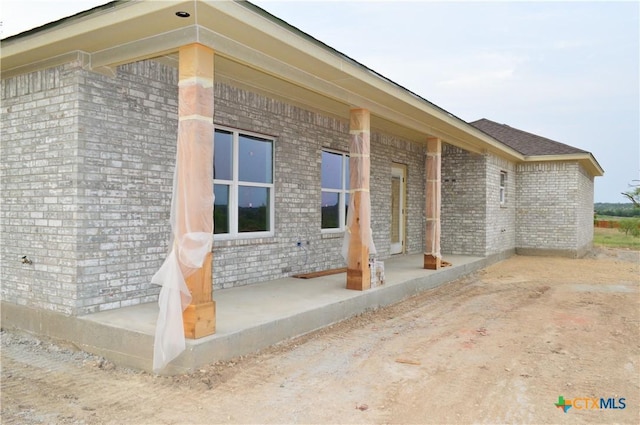 425 County Road 3152, Kempner, TX 76539 - view of property exterior featuring brick siding and covered porch