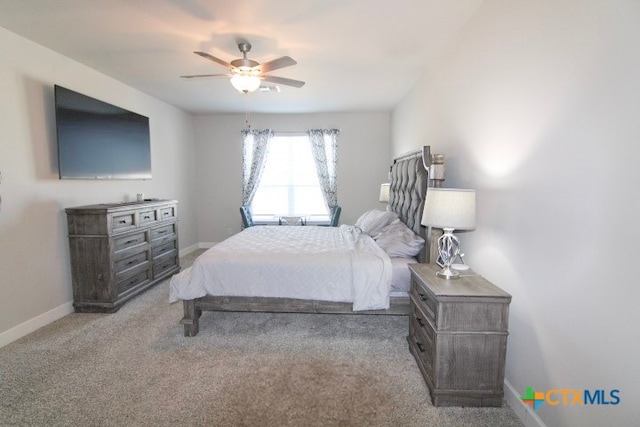 bedroom with ceiling fan and light colored carpet