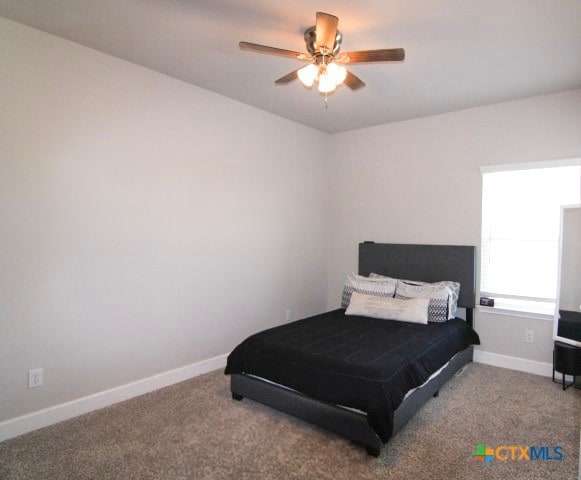 carpeted bedroom featuring ceiling fan