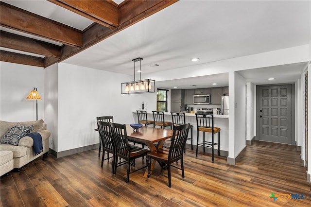 dining room featuring recessed lighting, dark wood finished floors, and baseboards