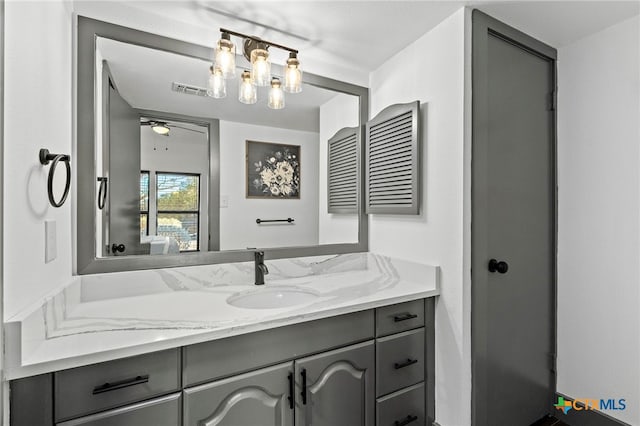 bathroom with visible vents and vanity